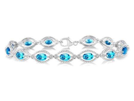 1 10 Ctw Round Cut Diamond & 6x4 MM Oval Cut Blue Topaz Semi Precious Bracelet in Sterling Silver For Sale